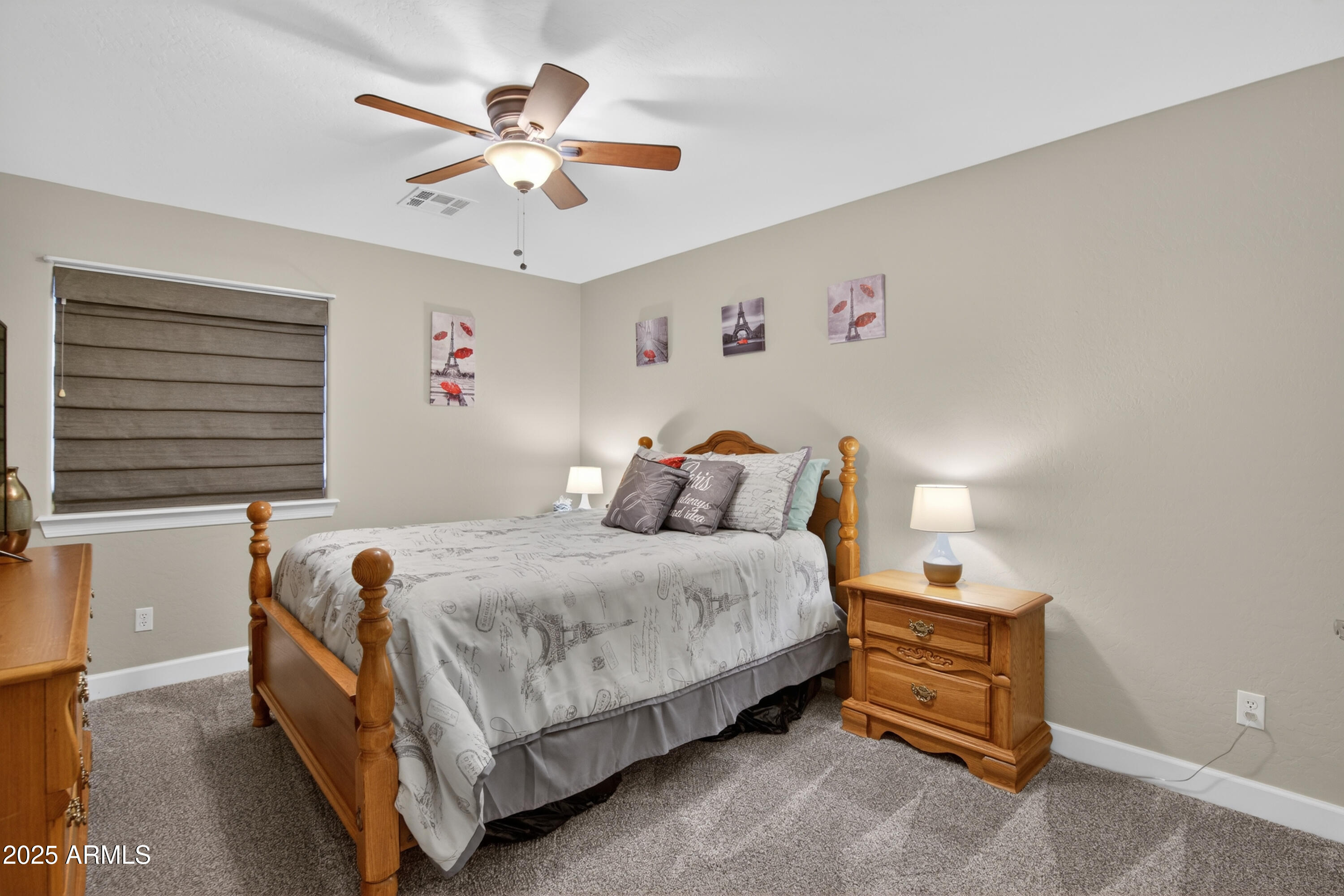 13438 West Redfield Road Surprise, AZ 85379 - Photo 46 of 75 a bedroom with a bed and a chandelier