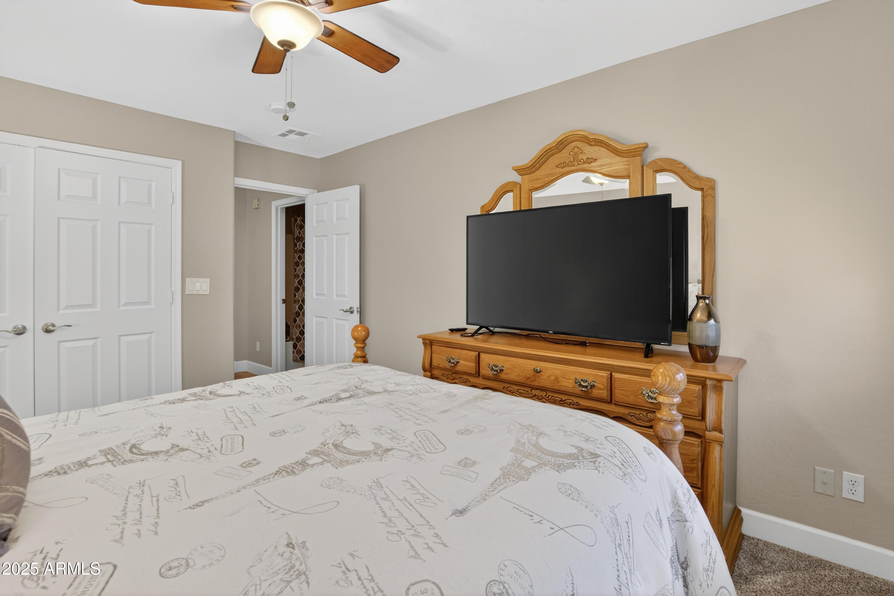 13438 West Redfield Road Surprise, AZ 85379 - Photo 48 of 75 a bedroom with a bed and a flat screen tv