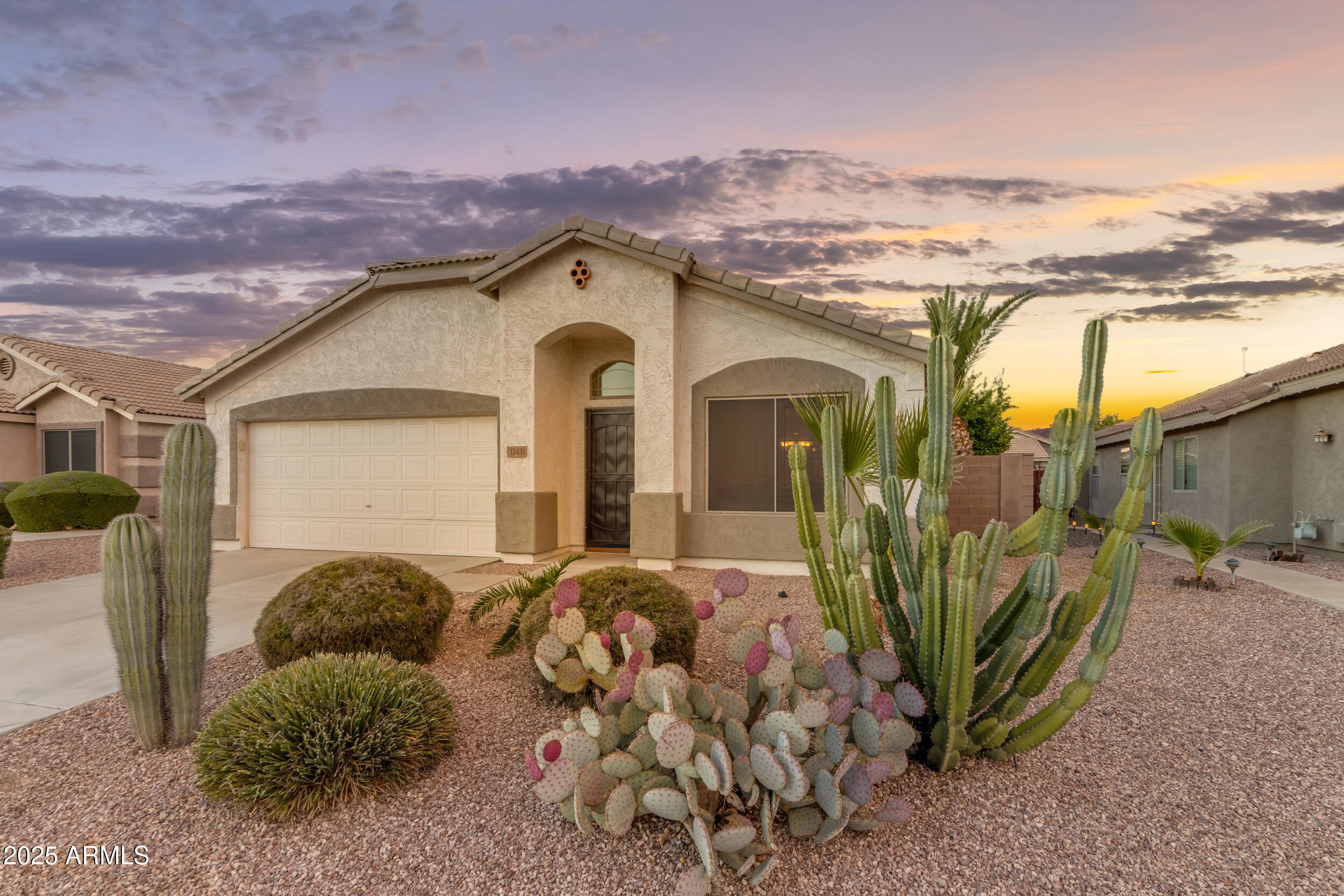 13438 West Redfield Road Surprise, AZ 85379 - Photo 3 of 75 a view of a house with a floor to ceiling window and a yard