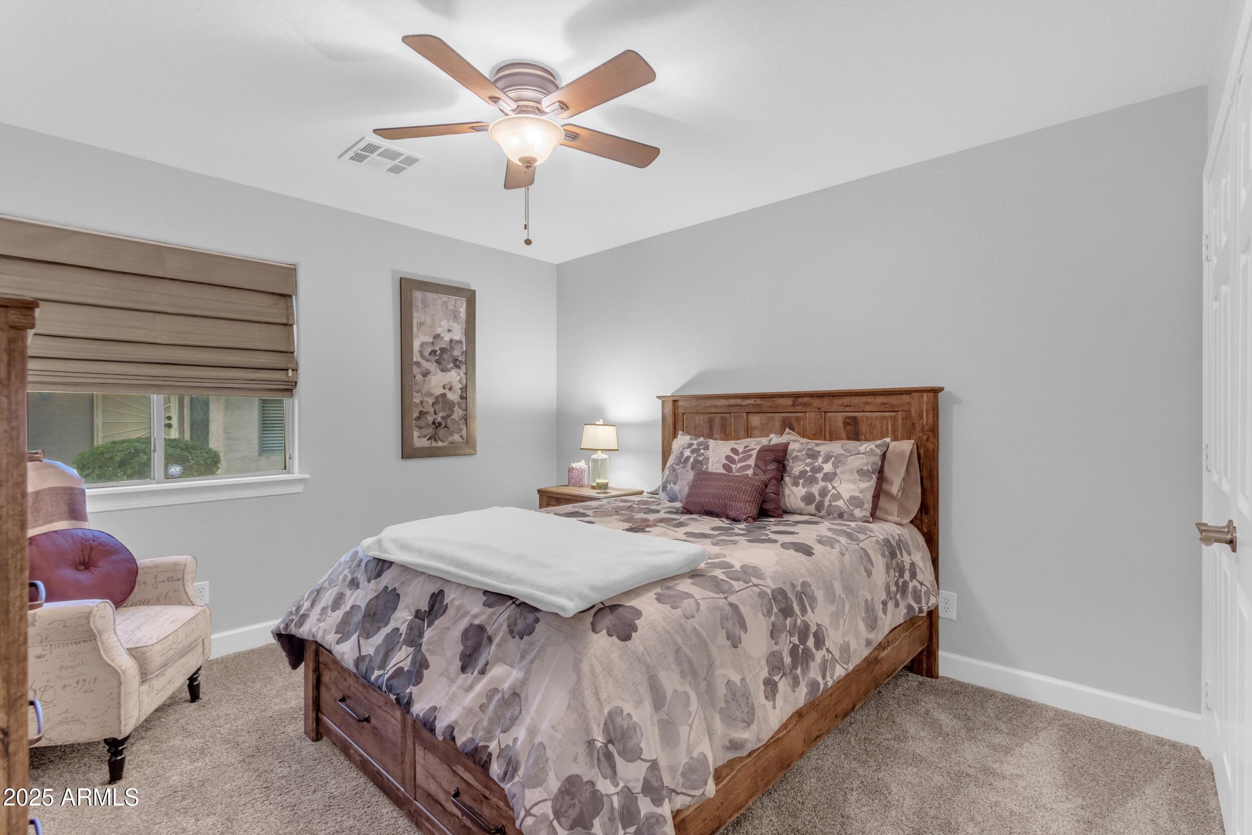 13438 West Redfield Road Surprise, AZ 85379 - Photo 50 of 75 a bedroom with a bed and a window