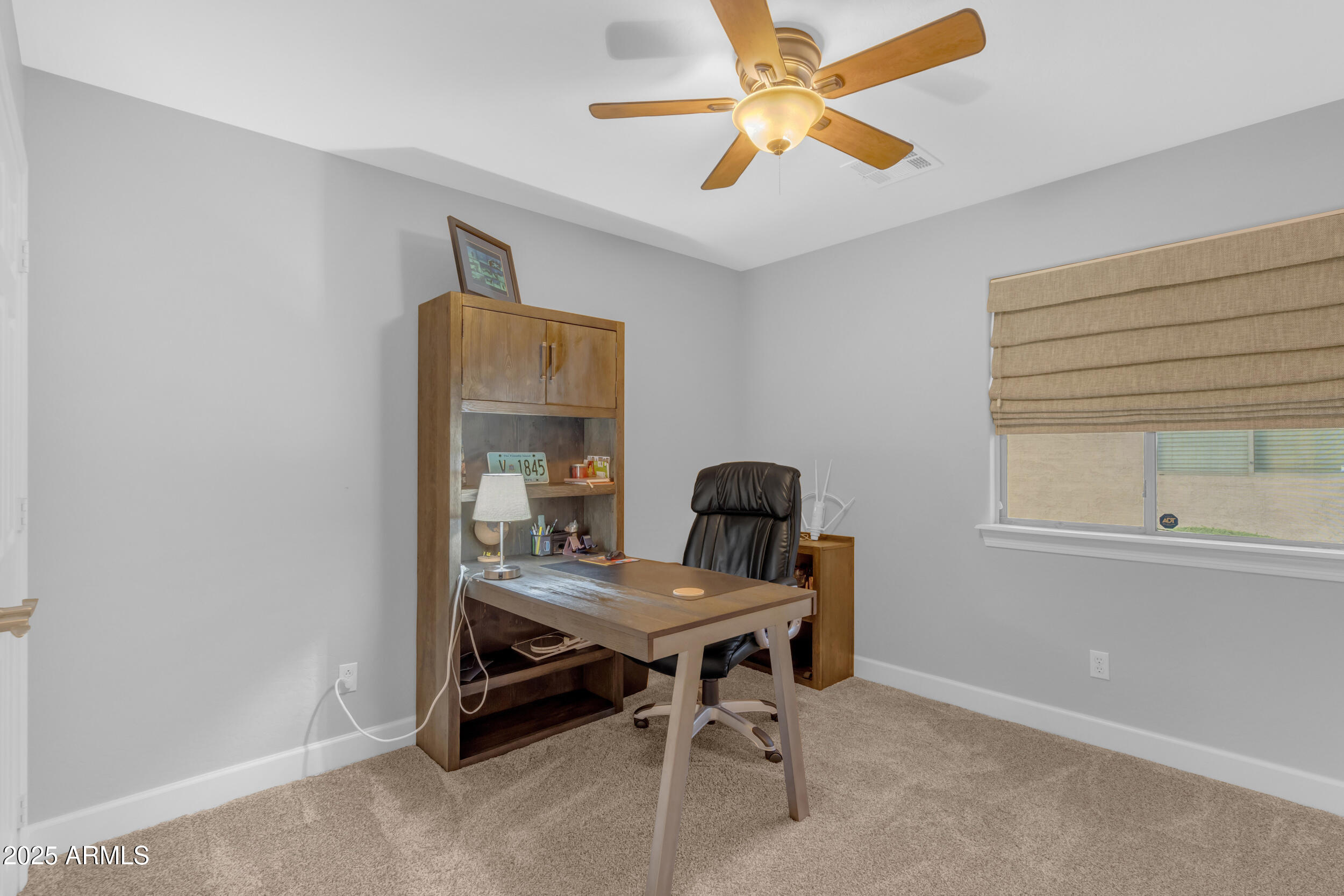 13438 West Redfield Road Surprise, AZ 85379 - Photo 53 of 75 a view of a workspace with furniture and a window