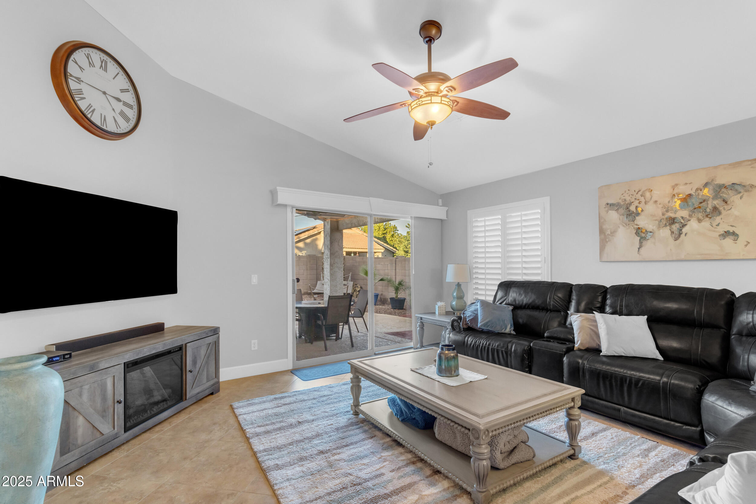 13438 West Redfield Road Surprise, AZ 85379 - Photo 57 of 75 a living room with furniture a rug and a flat screen tv