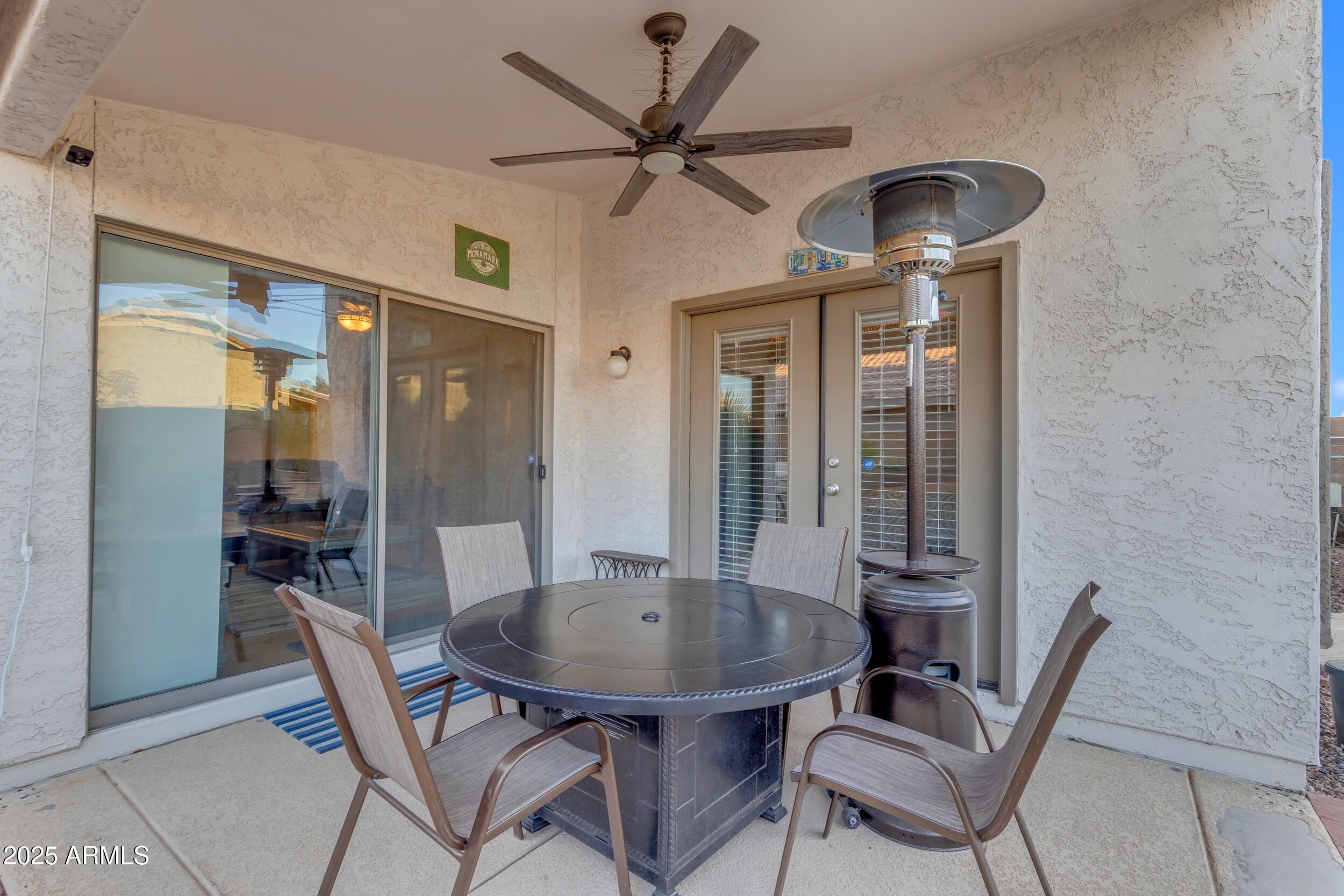 13438 West Redfield Road Surprise, AZ 85379 - Photo 60 of 75 a view of a dining room with furniture and a chandelier