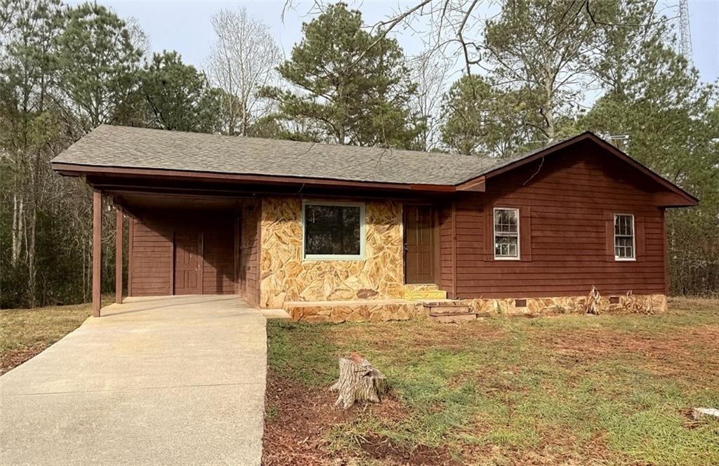 3945 Maple Grove Church Road Resaca, GA 30735 - Photo 1 of 1 a front view of a house with yard and seating area