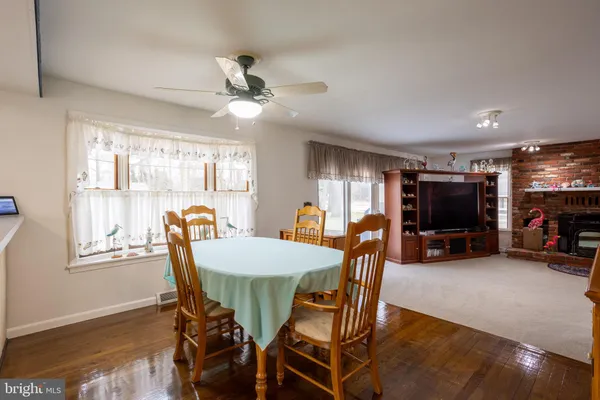 a view of a living room and dining room