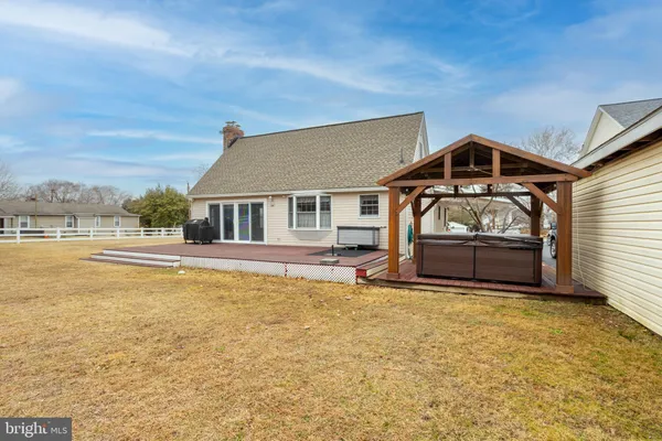 a house view with swimming pool in front of it
