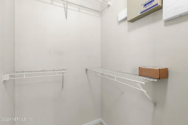 a house view with a sitting space and garden