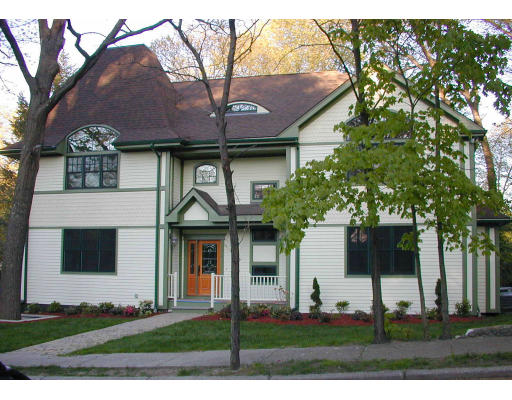 6 Cottonwood Road Newton, MA 02459 - Photo 1 of 9 a front view of a house with a yard