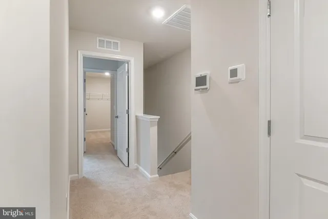 a view of a hallway with closet