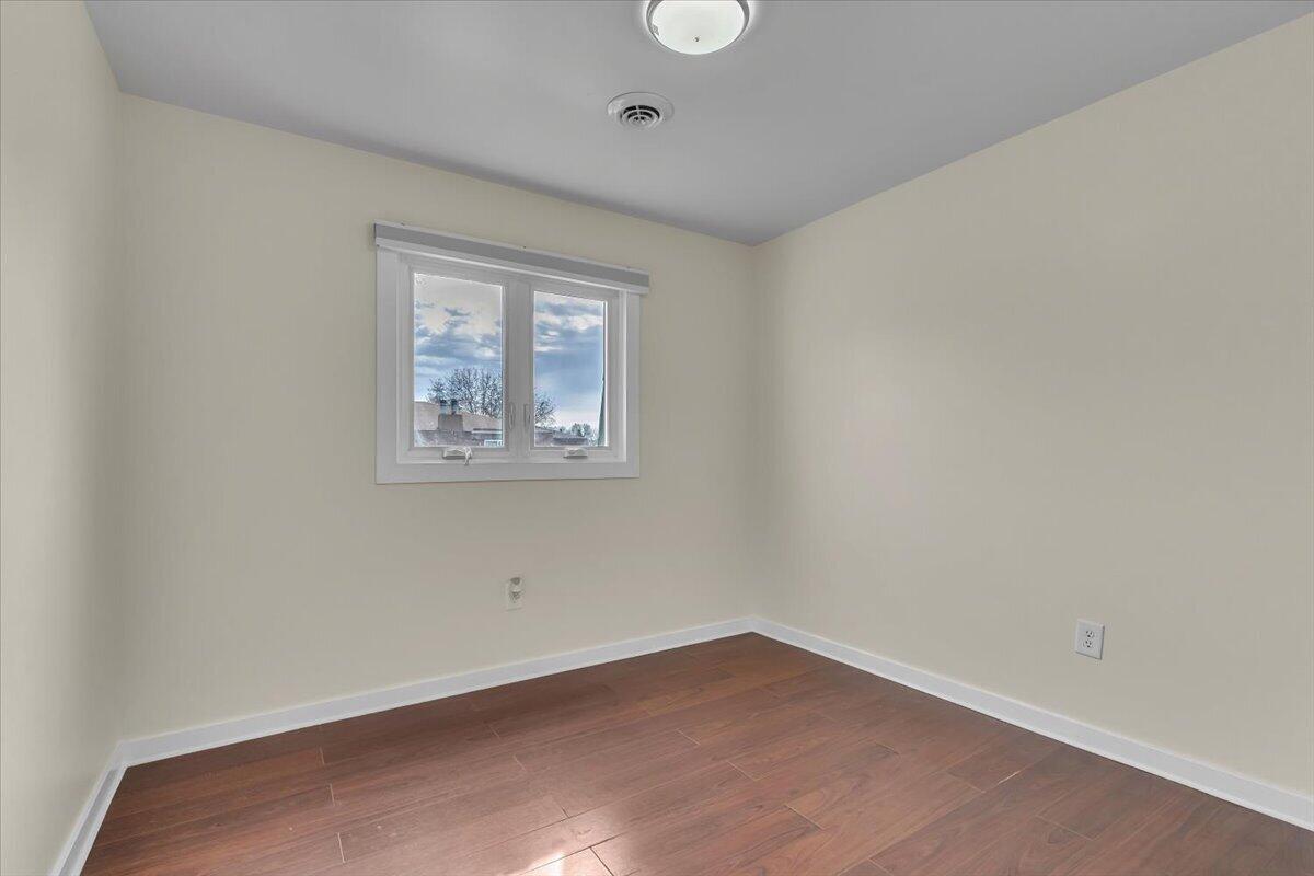 1444 Woodview Drive, Unit 7 Crown Point, IN 46307 - Photo 12 of 15 an empty room with a window