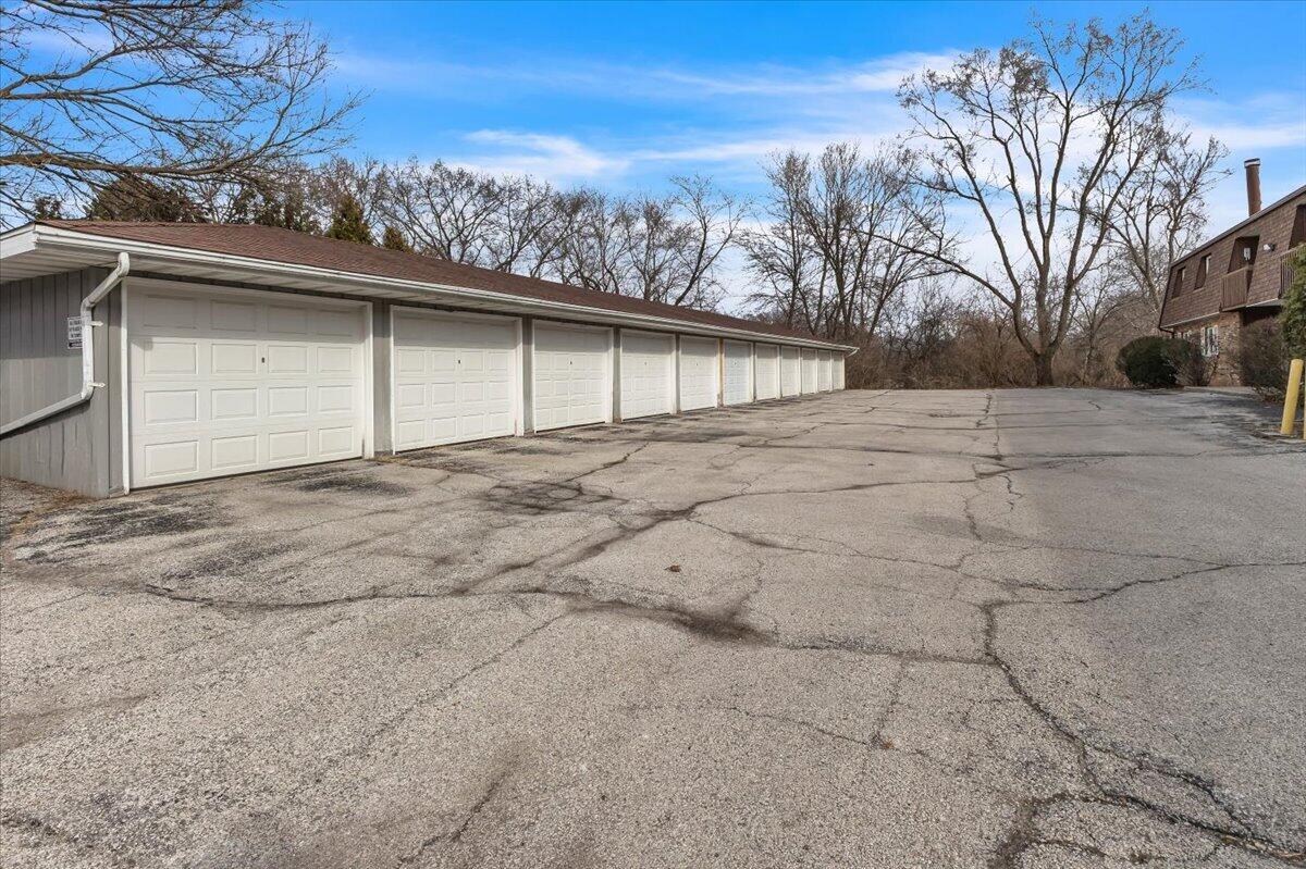 1444 Woodview Drive, Unit 7 Crown Point, IN 46307 - Photo 15 of 15 a view of garage yard and tree