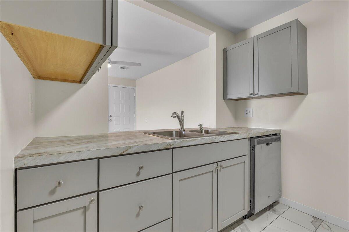 1444 Woodview Drive, Unit 7 Crown Point, IN 46307 - Photo 7 of 15 a utility room with cabinets