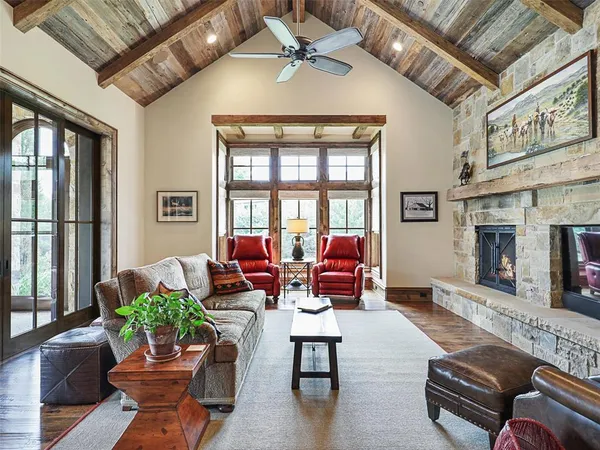 a outdoor living space with patio furniture and a fireplace