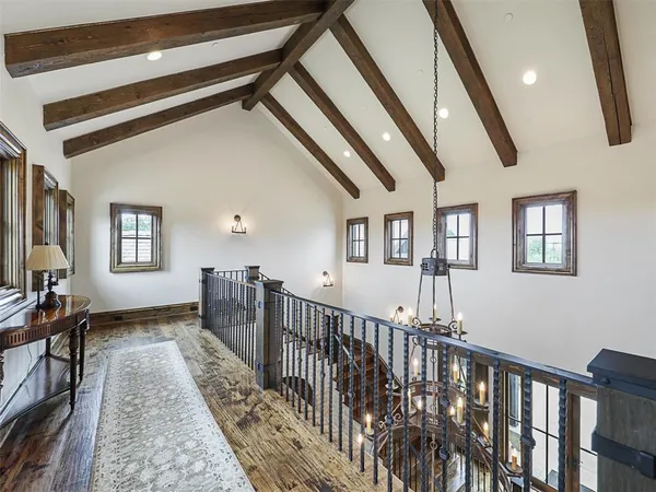 a view of an entryway wooden floor and windows