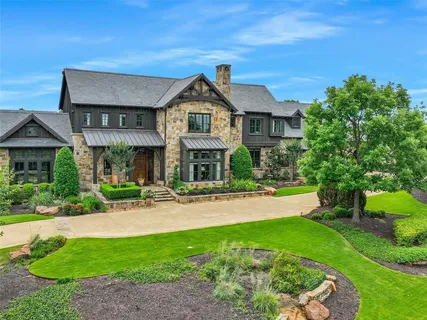 a front view of a house with a yard and porch