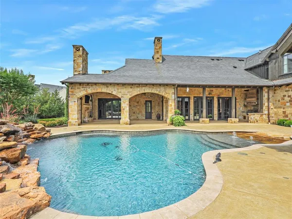 a view of a patio with swimming pool