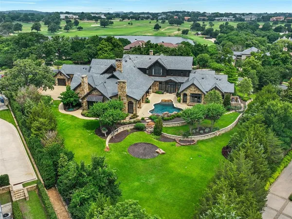 an aerial view of residential house with outdoor space and street view