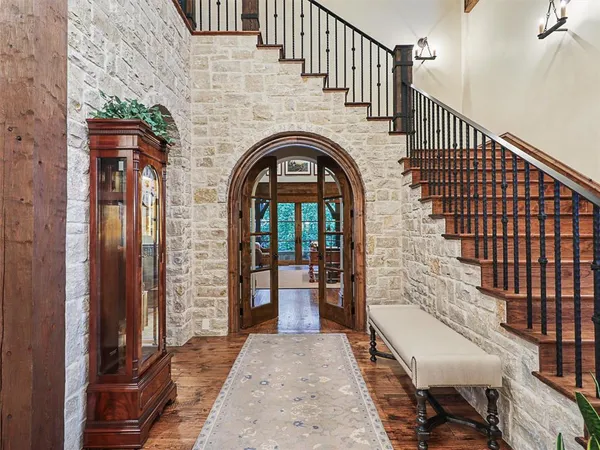 a view of hall way with furniture