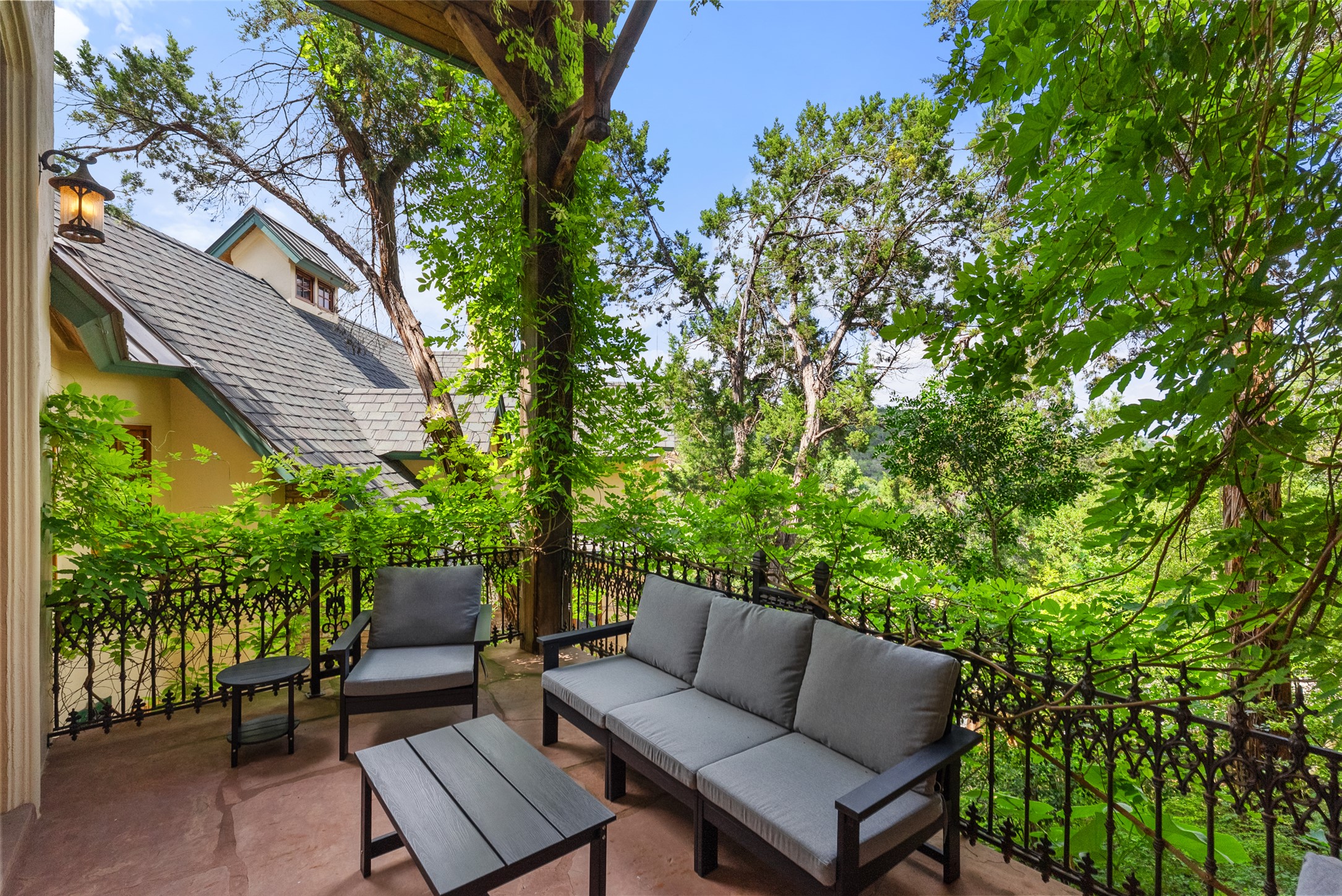 1354 The High Road Austin, TX 78746 - Photo 22 of 40 A tranquil balcony provides a private oasis amidst lush greenery.