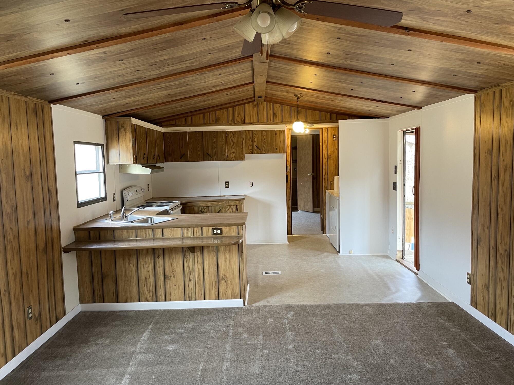 3163 North Fork Road Elliston, VA 24087 - Photo 3 of 10 a kitchen with a stove and a refrigerator