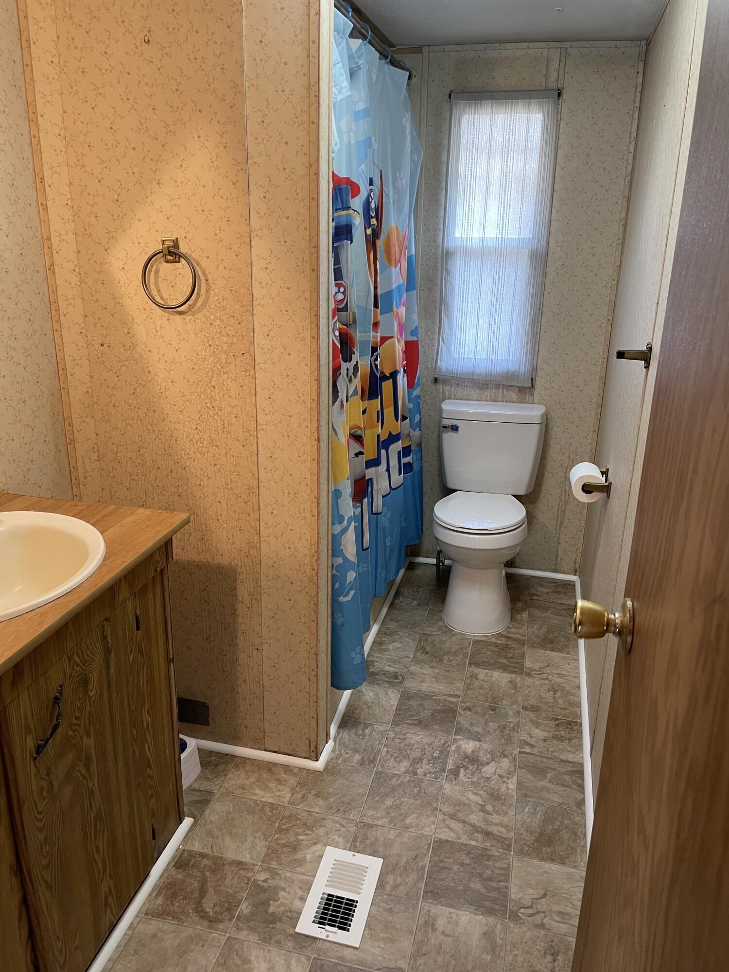 3163 North Fork Road Elliston, VA 24087 - Photo 8 of 10 a bathroom with a toilet and a sink