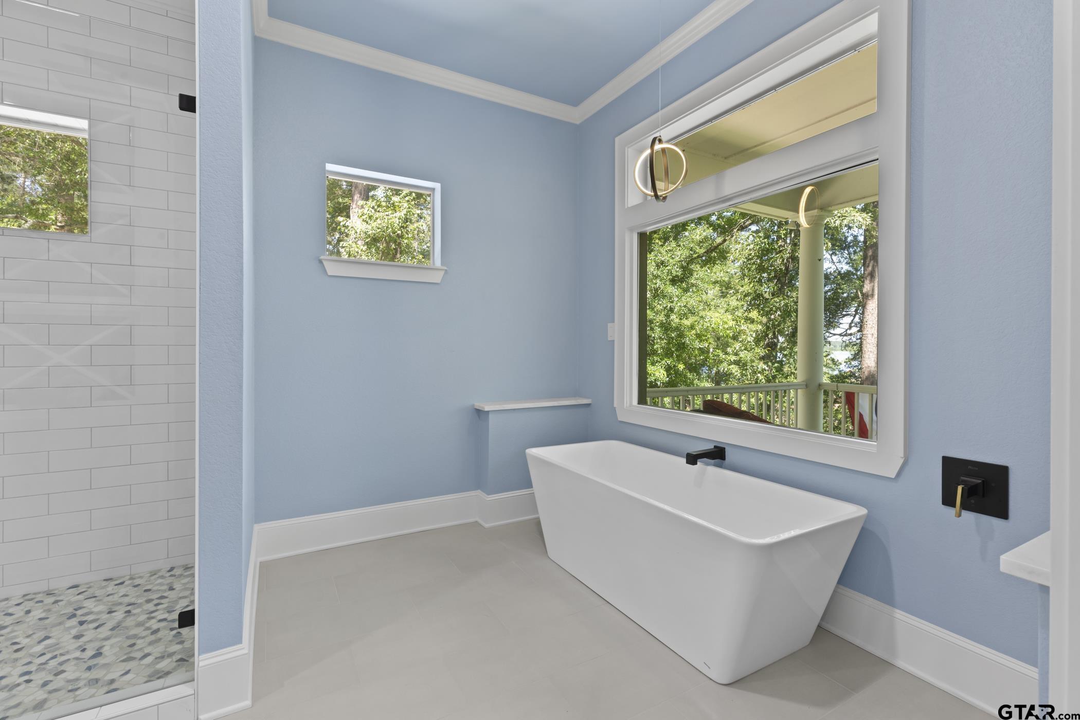 18630 Eastside Road Troup, TX 75789 - Photo 25 of 47 a white bath tub sitting next to a window