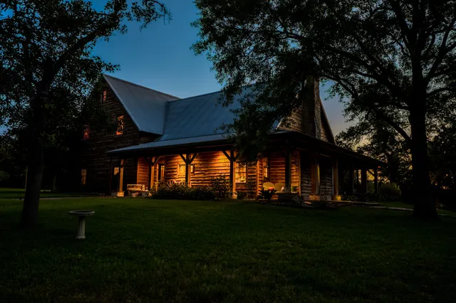 a view of a yard in front of house with a green space