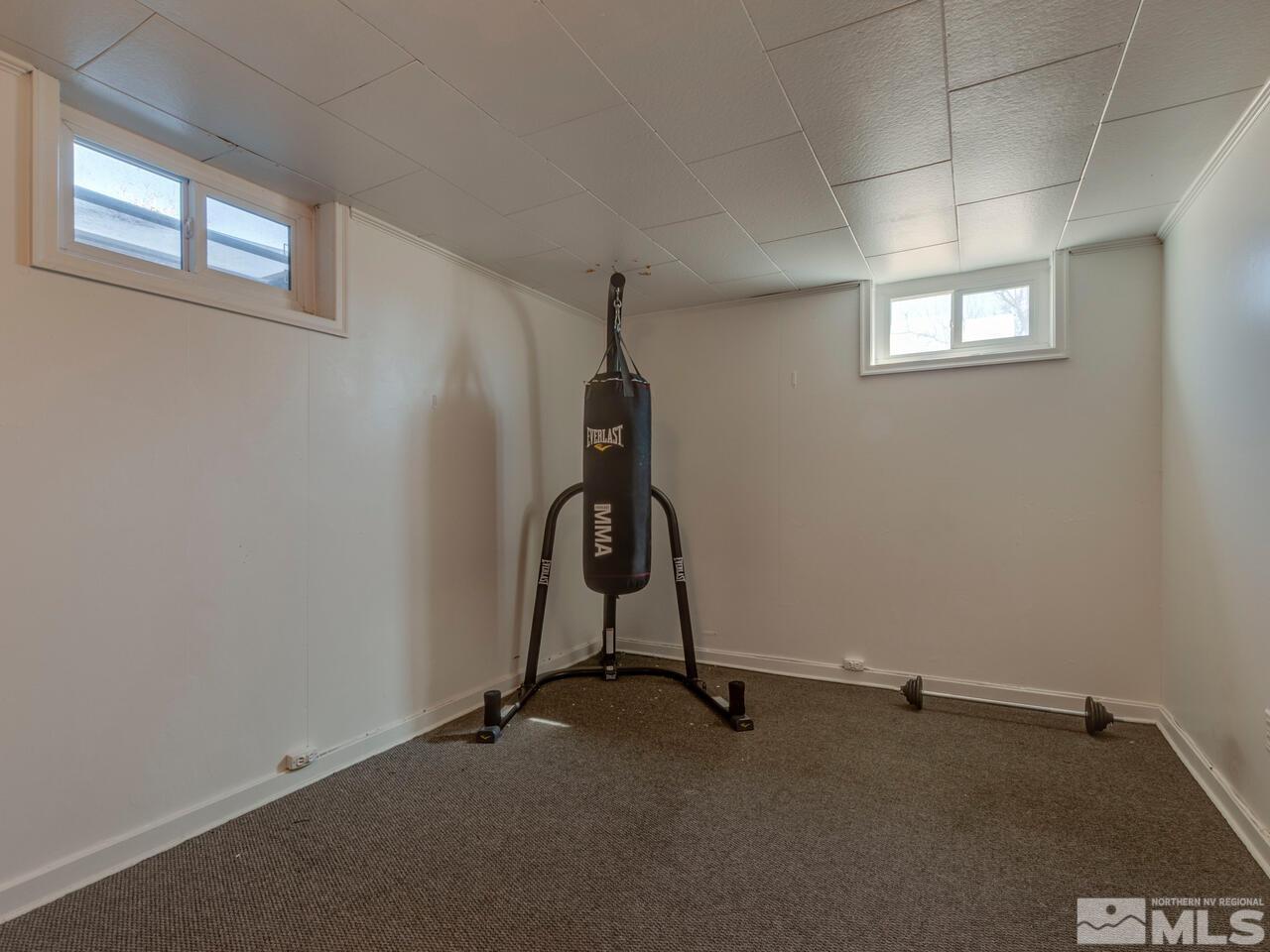 1061 Whitaker Drive Reno, NV 89503 - Photo 17 of 20 a room with gym equipment and windows