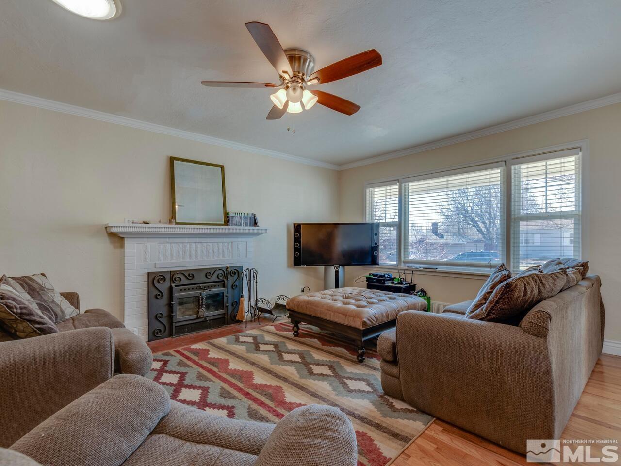 1061 Whitaker Drive Reno, NV 89503 - Photo 5 of 20 a living room with furniture fireplace and window