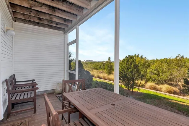 front view of a house with a bench