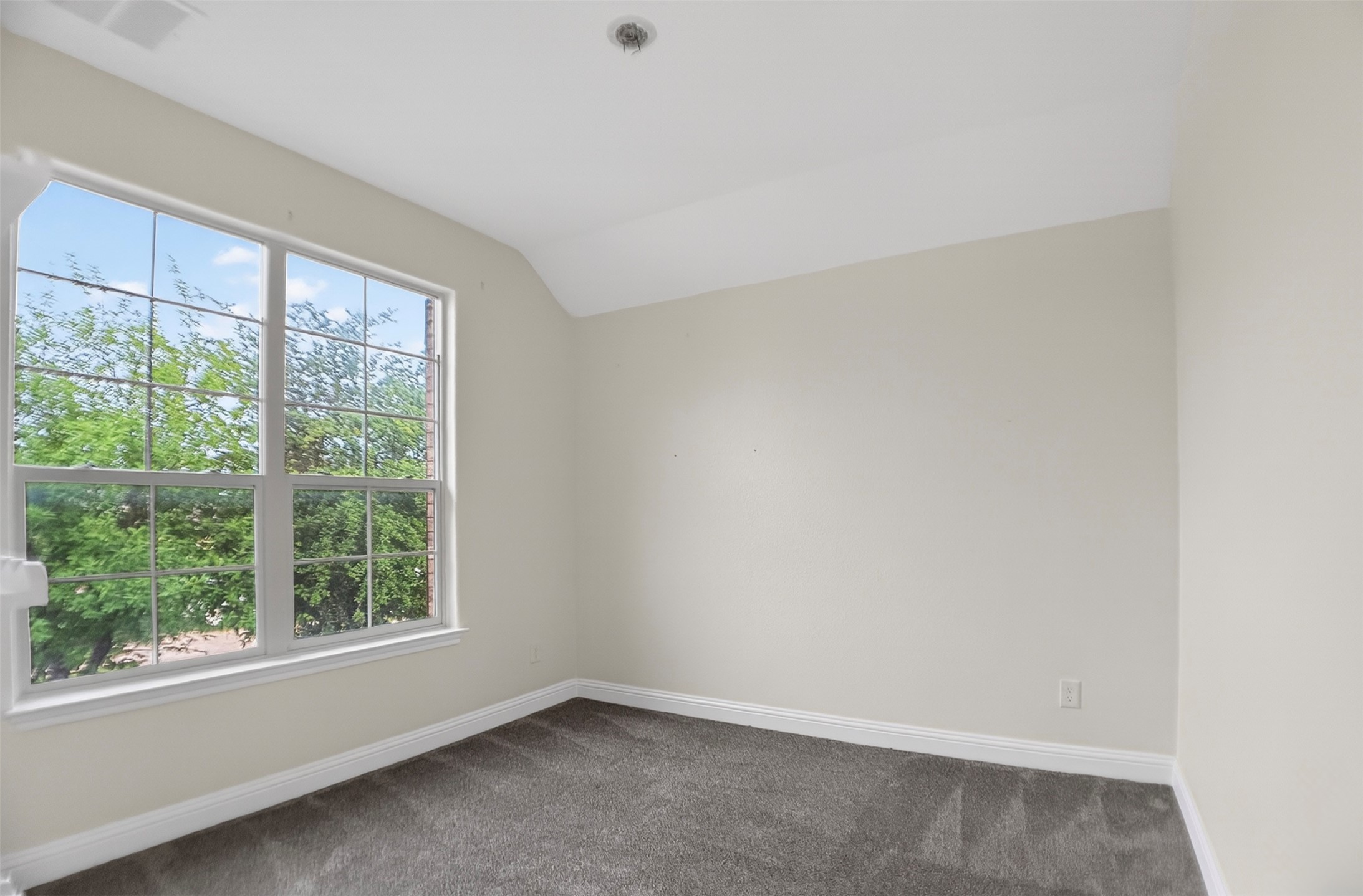 1505 Long Shadow Lane Georgetown, TX 78628 - Photo 26 of 28 Room with neutral wall tones and dark gray carpeting
