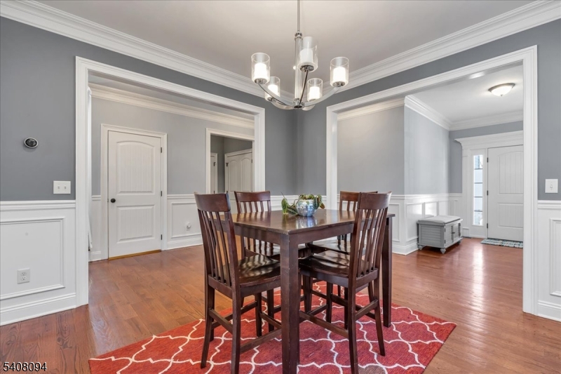 177 Maple Street Bridgewater, NJ 08807 - Photo 13 of 37 a view of a dining room with furniture and wooden floor