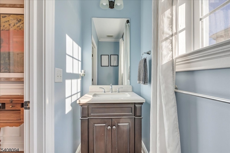 177 Maple Street Bridgewater, NJ 08807 - Photo 15 of 37 a bathroom with a sink and a mirror