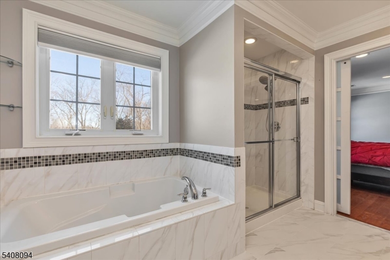 177 Maple Street Bridgewater, NJ 08807 - Photo 20 of 37 a bathroom with a bathtub and a shower