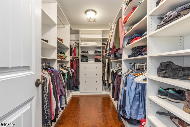 177 Maple Street Bridgewater, NJ 08807 - Photo 21 of 37 a view of walk in closet with clothes and shoes