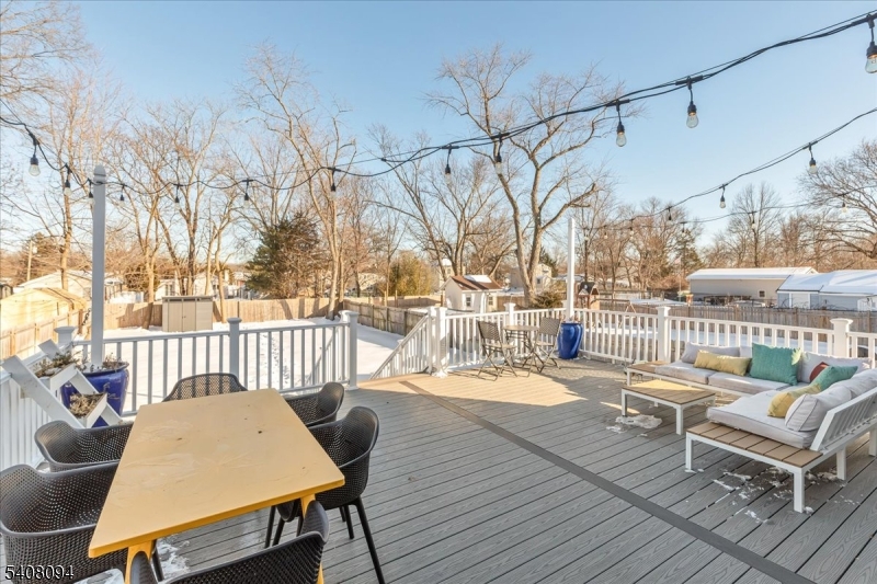 177 Maple Street Bridgewater, NJ 08807 - Photo 33 of 37 a balcony with wooden floor table and chairs