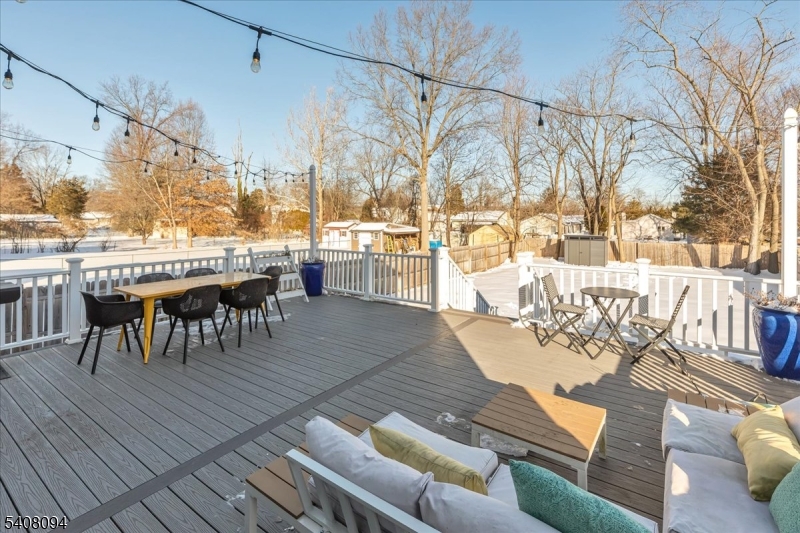 177 Maple Street Bridgewater, NJ 08807 - Photo 34 of 37 a view of a patio with a dining table and chairs with wooden floor