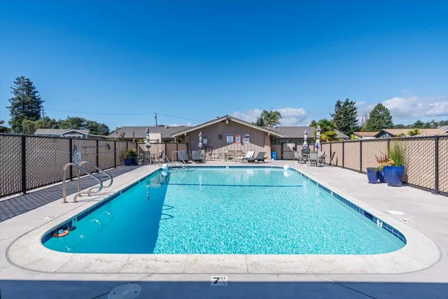 a view of a swimming pool with a lounge chairs