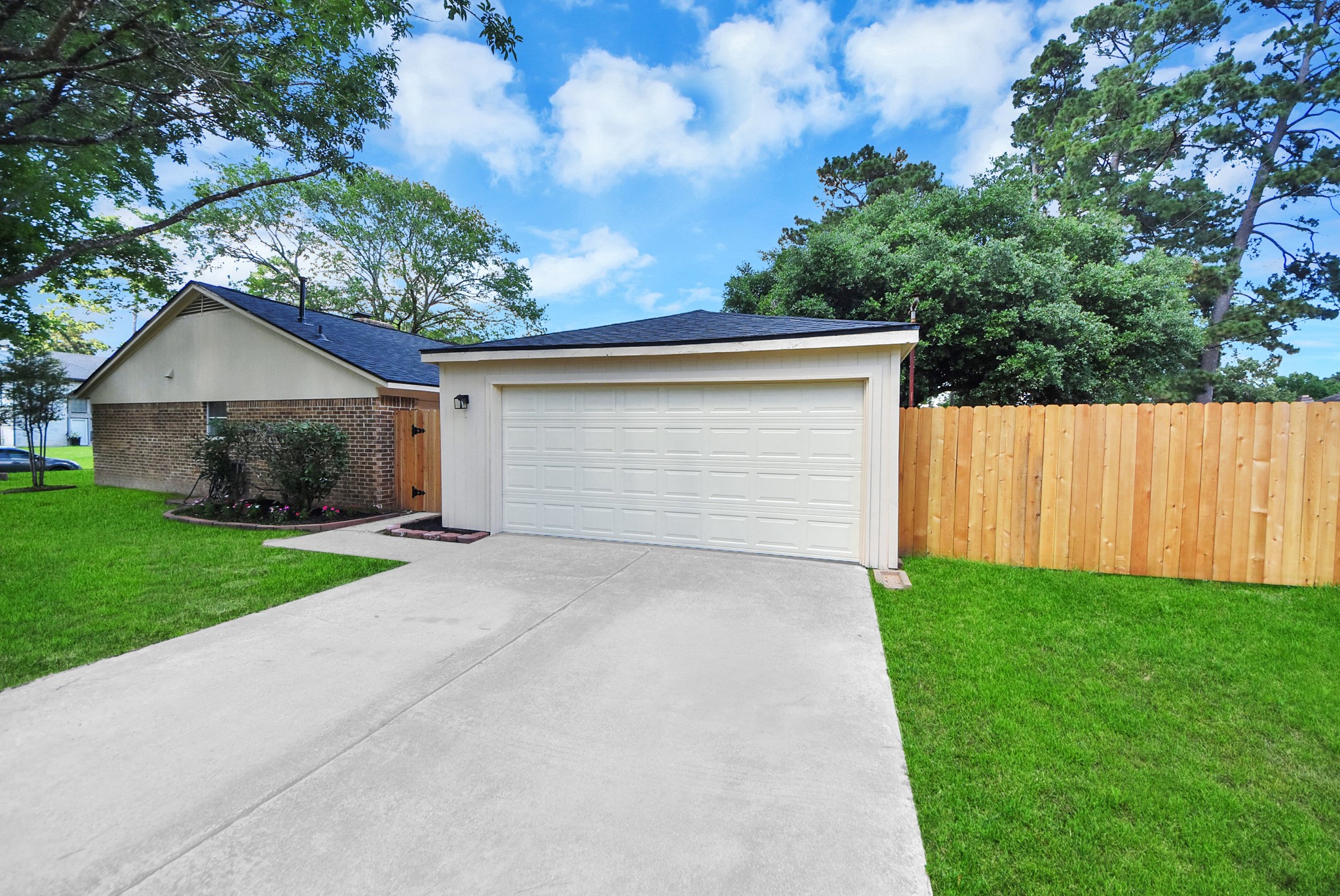 2402 Rolling Glen Drive Spring, TX 77373 - Photo 3 of 38 a front view of house with yard and trees in the background