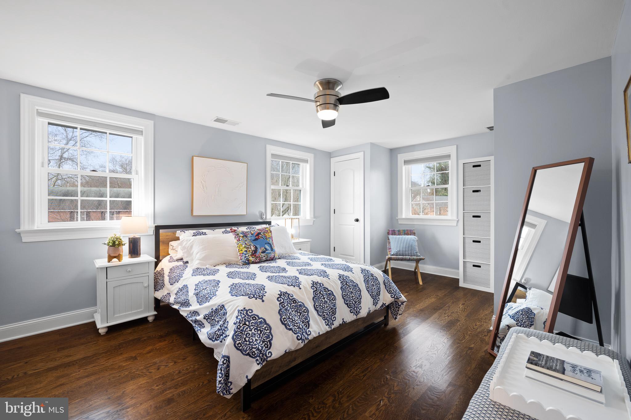 115 Barcladen Road Bryn Mawr, PA 19010 - Photo 19 of 39 a bedroom with a bed wooden floor and a window