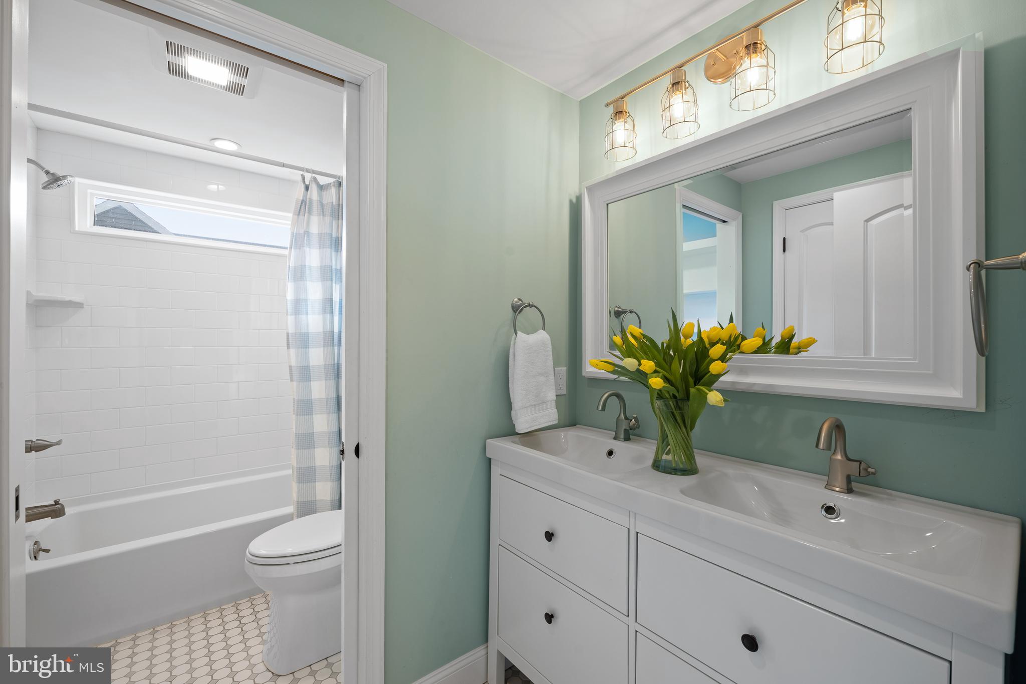 115 Barcladen Road Bryn Mawr, PA 19010 - Photo 22 of 39 a bathroom with a sink a toilet and a mirror
