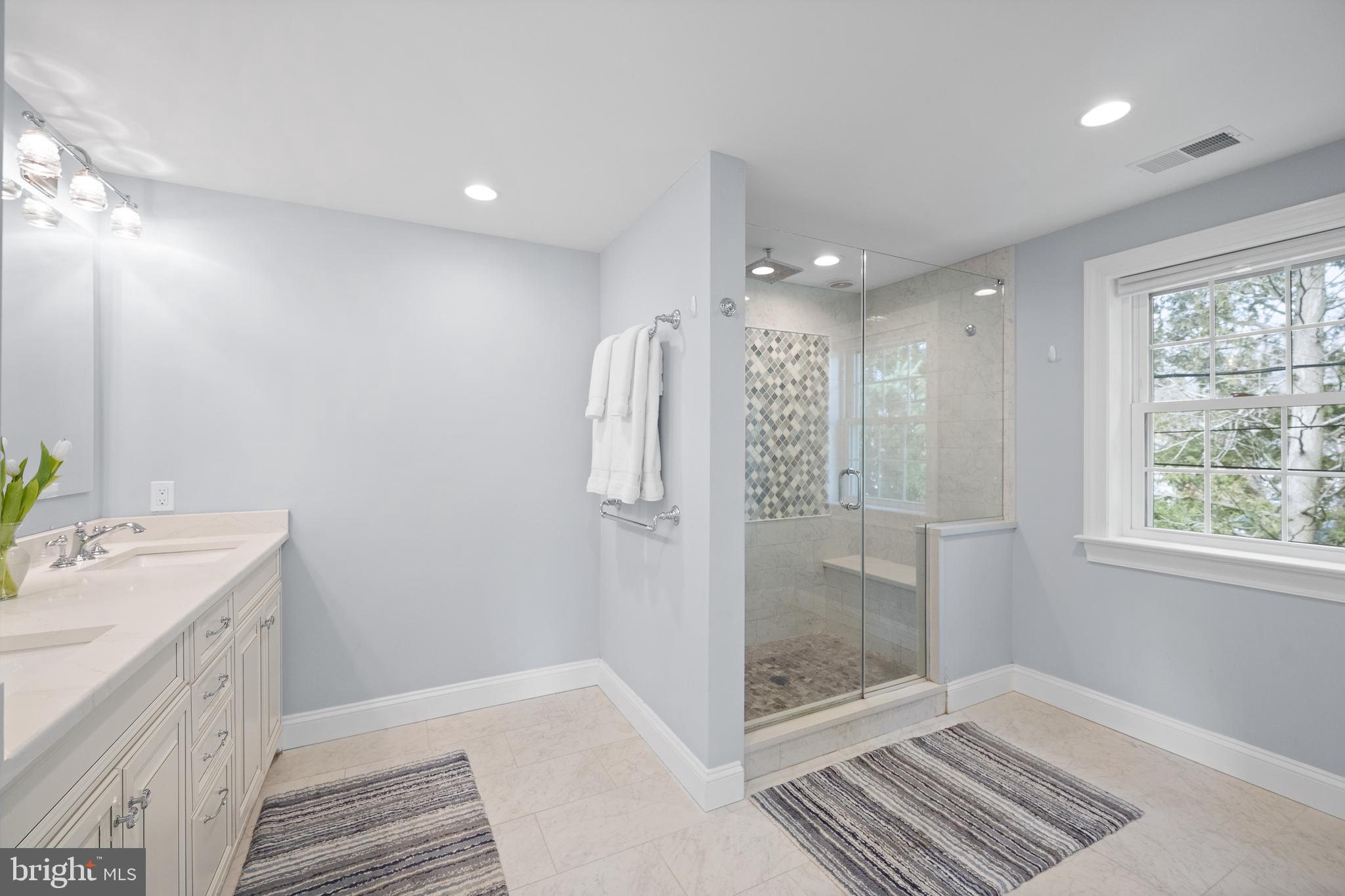 115 Barcladen Road Bryn Mawr, PA 19010 - Photo 30 of 39 a bathroom with a sink and a mirror