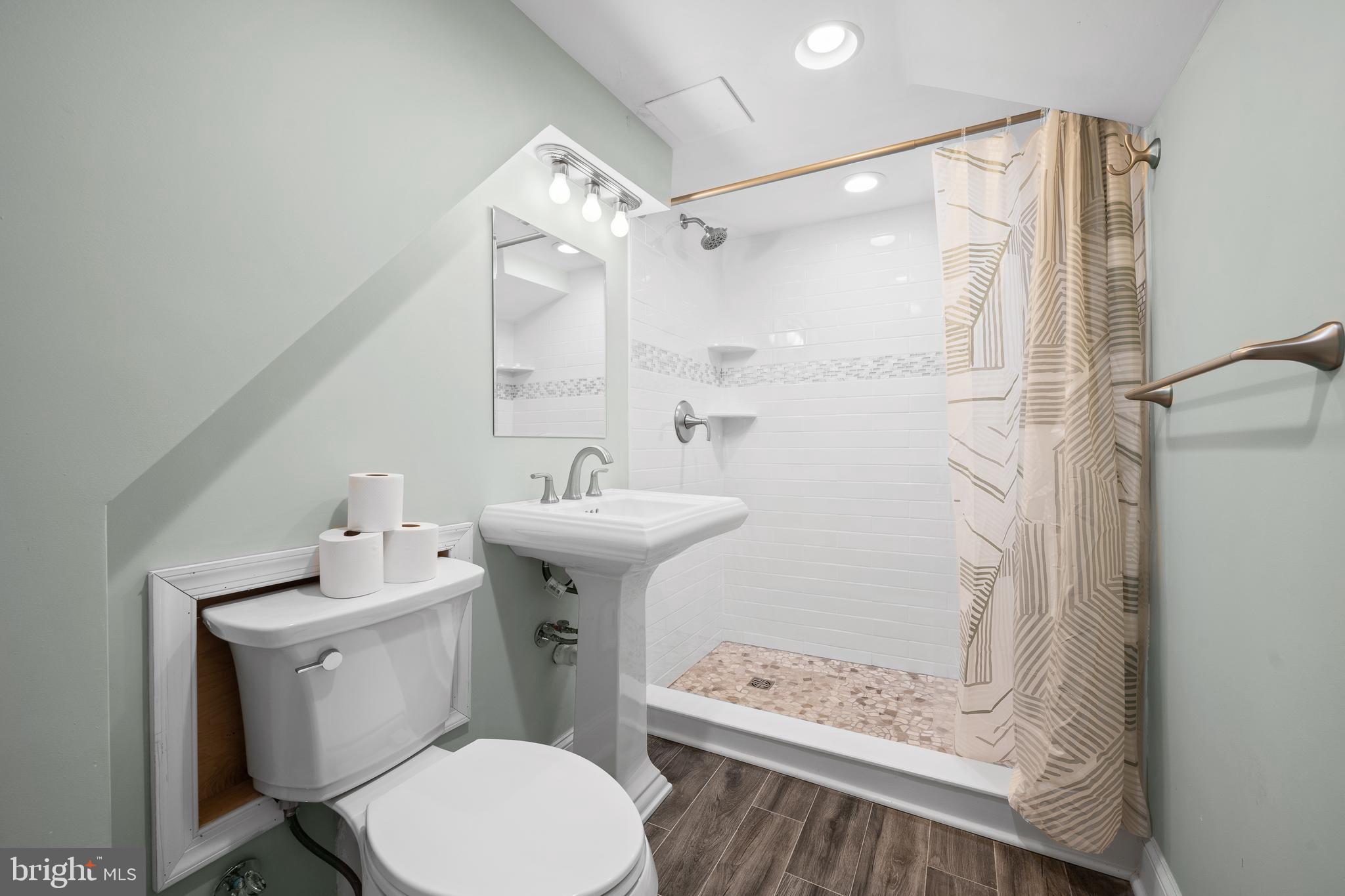 115 Barcladen Road Bryn Mawr, PA 19010 - Photo 34 of 39 a bathroom with a sink toilet and shower