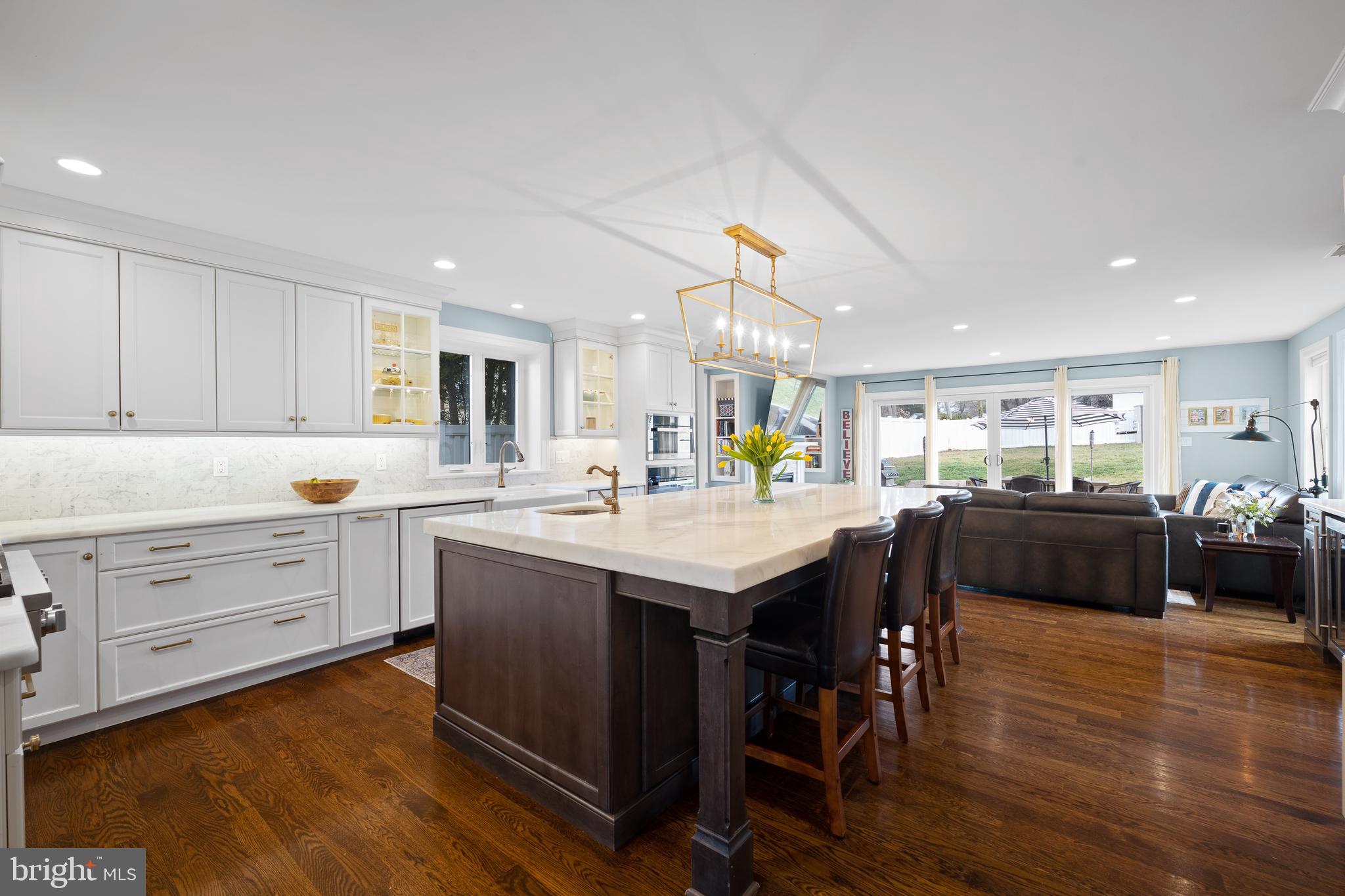 115 Barcladen Road Bryn Mawr, PA 19010 - Photo 4 of 39 a kitchen with a table chairs sink and cabinets