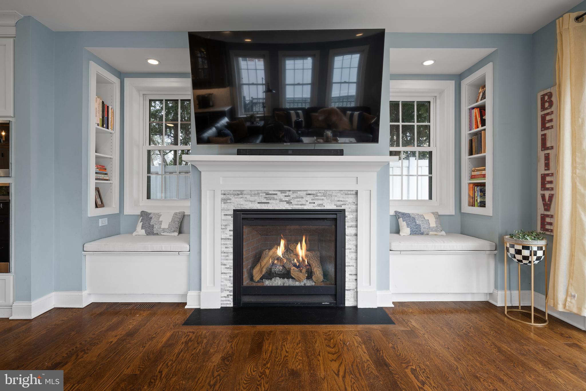 115 Barcladen Road Bryn Mawr, PA 19010 - Photo 9 of 39 a living room with a fireplace and a fireplace