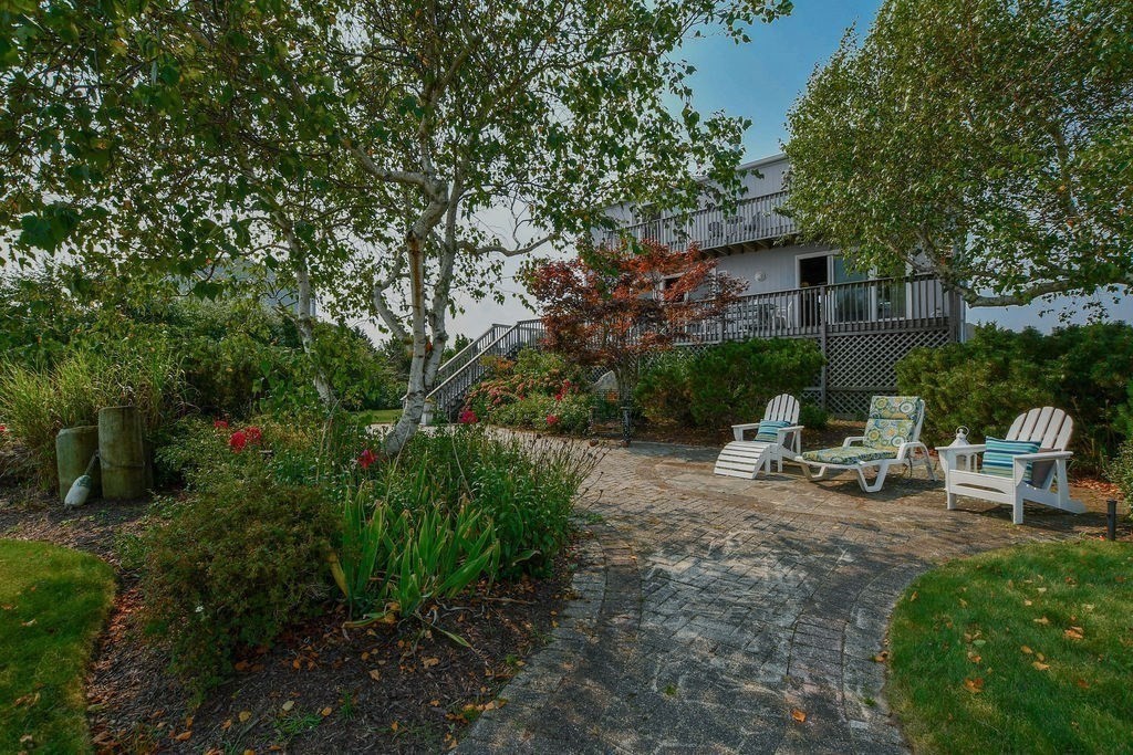 14 Sias Point Road Wareham, MA 02532 - Photo 11 of 42 a view of a house with backyard sitting area and garden