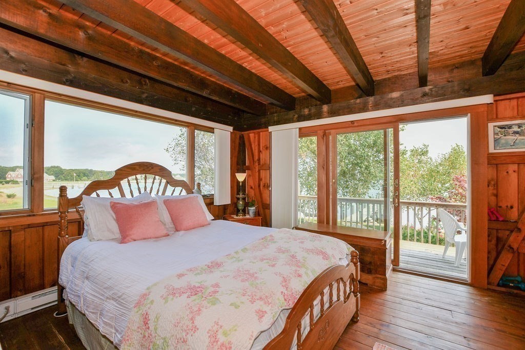 14 Sias Point Road Wareham, MA 02532 - Photo 23 of 42 a bedroom with a large bed and a large window