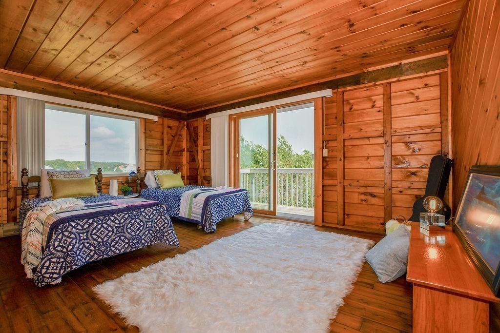 14 Sias Point Road Wareham, MA 02532 - Photo 26 of 42 a spacious bedroom with a bed and large windows