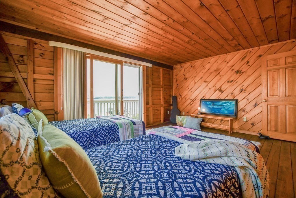 14 Sias Point Road Wareham, MA 02532 - Photo 27 of 42 a bedroom with a bed and wooden floor
