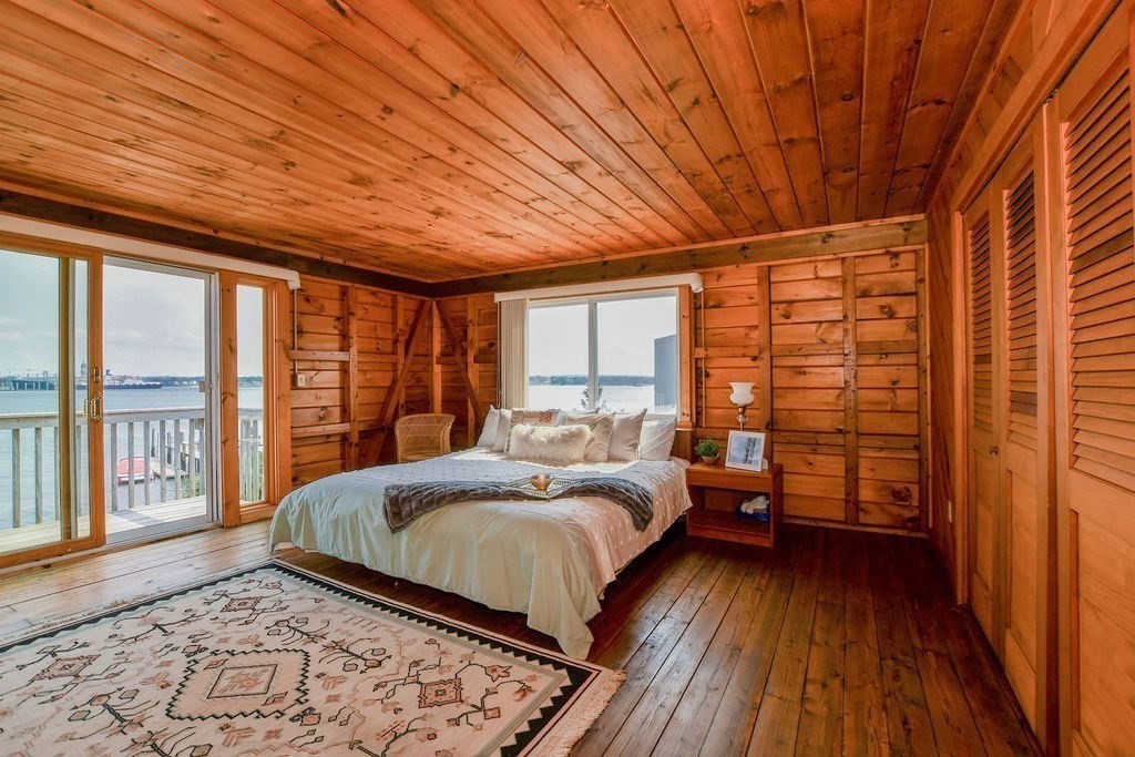 14 Sias Point Road Wareham, MA 02532 - Photo 28 of 42 a bedroom with a bed and wooden floor